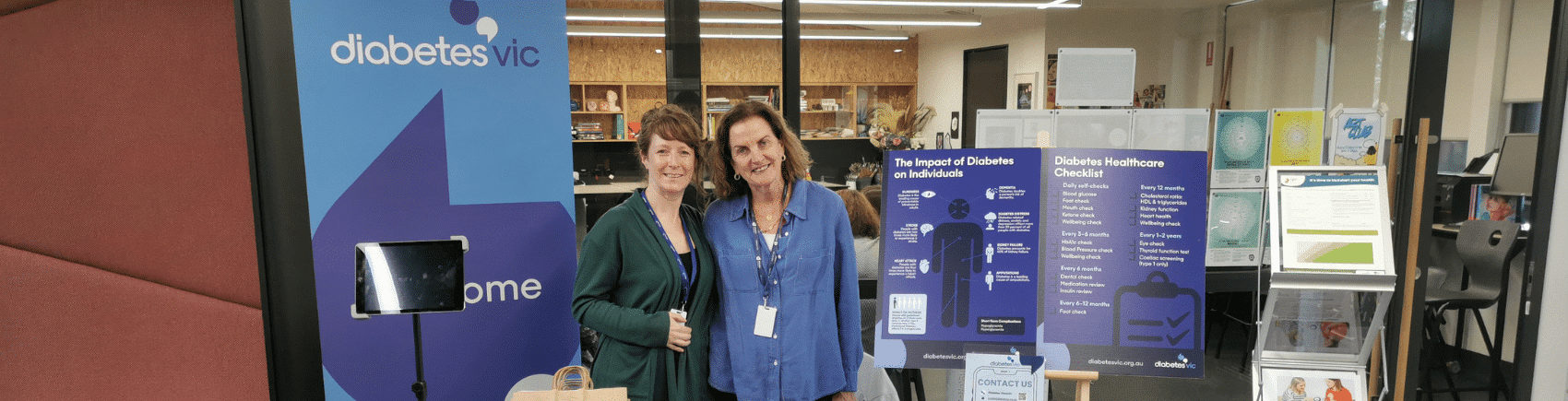 Life! team members standing in front of a Diabetes Victoria promotional stand